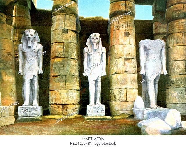 Three statues of Rameses II, Luxor, Egypt, 20th Century. Rameses II was an Egyptian pharaoh of the Nineteenth dynasty. His rule