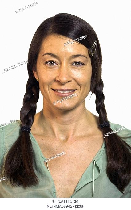Portrait of a smiling woman with braids