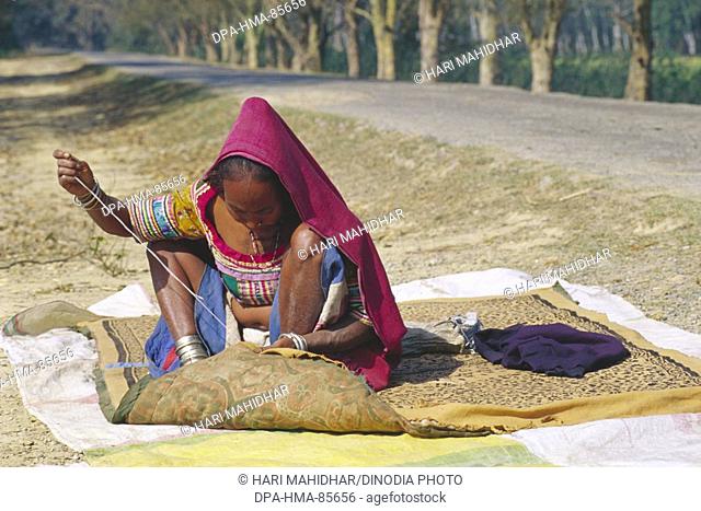 woman stitching , tharu village tribal , dudwa , uttar pradesh , india