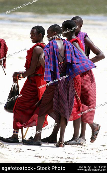 Group of young Maasai men on beach