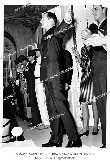 Hardy Amies taking a bow at his first menswear show, held at The Savoy Hotel, London