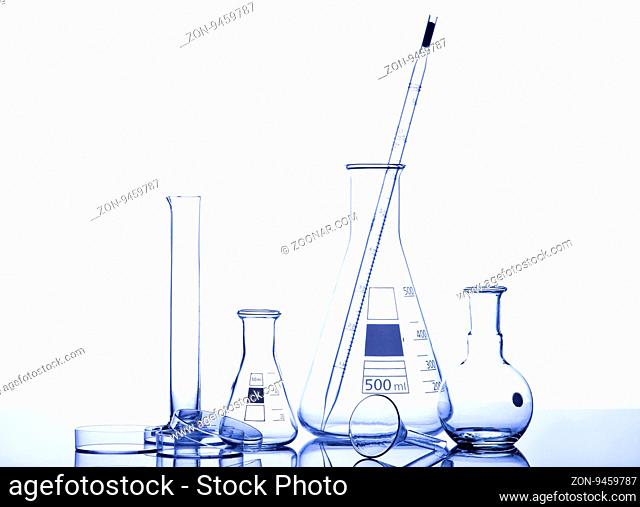 Test-tubes with reflections on a white and blue background. Laboratory glassware