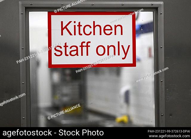 ILLUSTRATION - 20 December 2023, Berlin: ""Kitchen staff only"" is written on the door of a commercial kitchen and allows access to the kitchen for employees...