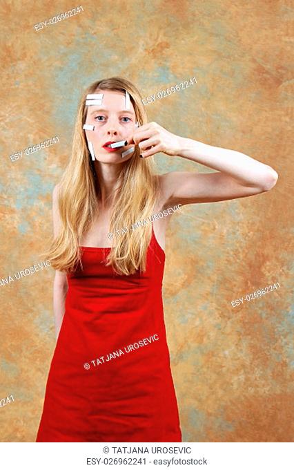 Woman removing price tag from her mouth showing concept women are not for sale