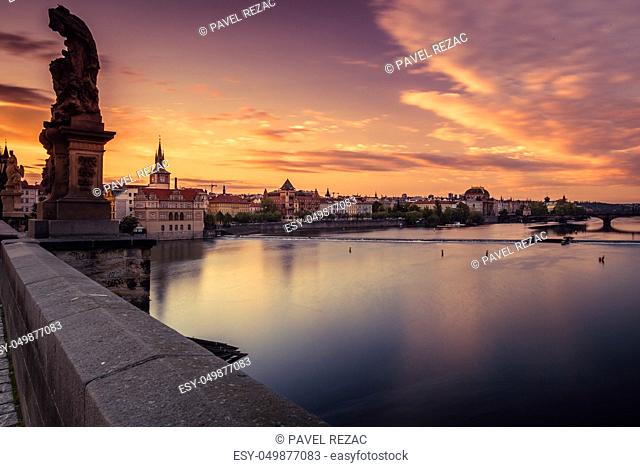 River Vltava and both banks of Prague at dawn, in the background National Theater
