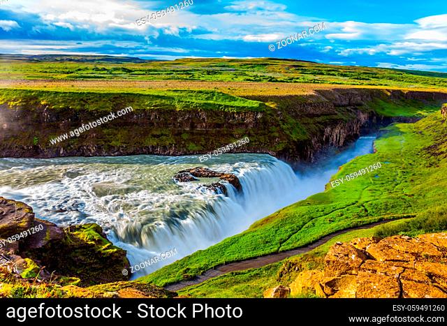 Picturesque multi-colored tundra on a sunny summer day. The most picturesque waterfall in Iceland - Gullfoss on the Hvitau River