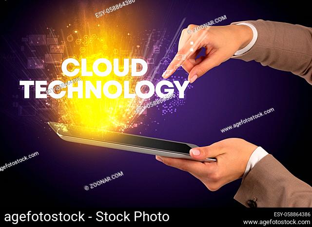 Close-up of a touchscreen with CLOUD TECHNOLOGY inscription, innovative technology concept