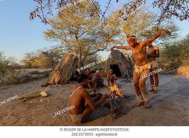 San or Bushman men dancing around a fire. Haina Kalahari Lodge. Botswana