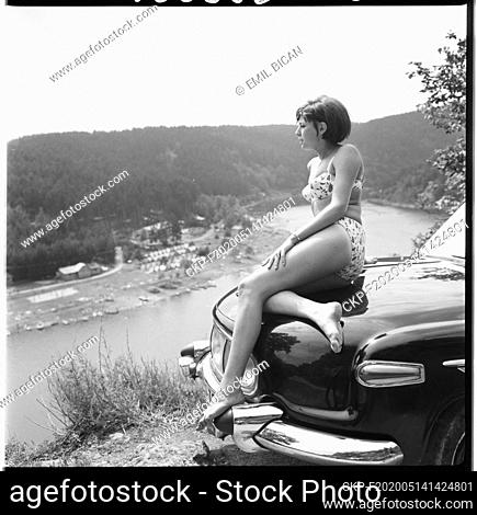 ***JULY 28, 1966 FILE PHOTO***Girl is sitting on the Car Tatra 603 near Vranovska Dam, Czechoslovakia, July 28, 1966. (CTK Photo/Emil Bican)