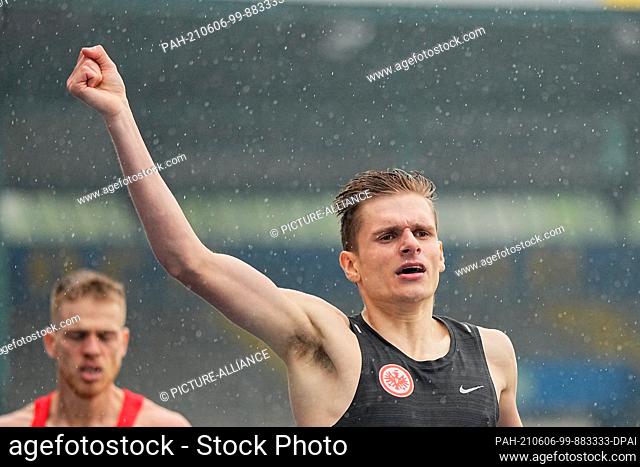 06 June 2021, Lower Saxony, Brunswick: Athletics: German Championships, 800m, Men: Marvin Heinrich cheers at the finish line