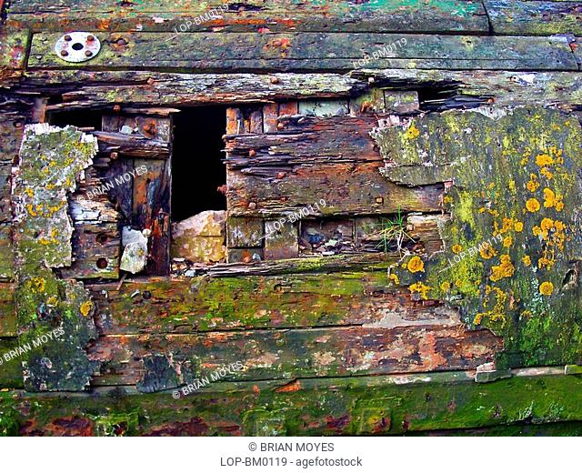 Scotland, Dunbartonshire, Bowling, Rotting hull of a boat on the Forth and Clyde Canal