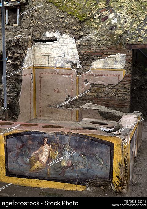 An undated handout photo made available by the Archaeological Park of Pompeii on 26 December 2020 shows a newly unearthed 'Thermopolium' at the archaeological...