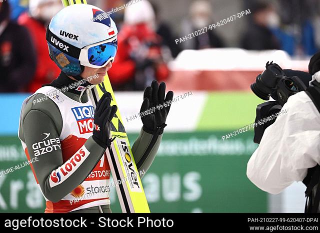 27 February 2021, Bavaria, Oberstdorf: Nordic skiing: World Championships, ski jumping - normal hill, men, 2nd round. Kamil Stoch from Poland reacts after the...