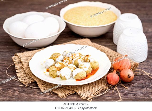 Traditional Turkish food, Mirik Kofte made from bulgur, onion and eggs with yoghurt