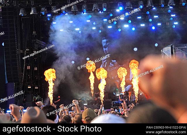 PRODUCTION - 02 September 2023, Bavaria, Munich: Rapper Kontra K at the music festival ""Superbloom"". Visitors dance at the concert in the Olympic Stadium