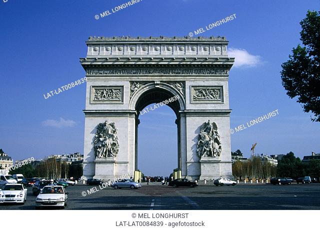 Arc de Triomphe. Huge ceremonial triumphal arch. Champs-Elysees. Traffic. Road. Cars