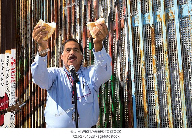 Tijuana, Mexico - Methodist Pastor Guillermo Navarrette leads Sunday interfaith worship of El Faro: the Border Church. The church meets on both sides of the...