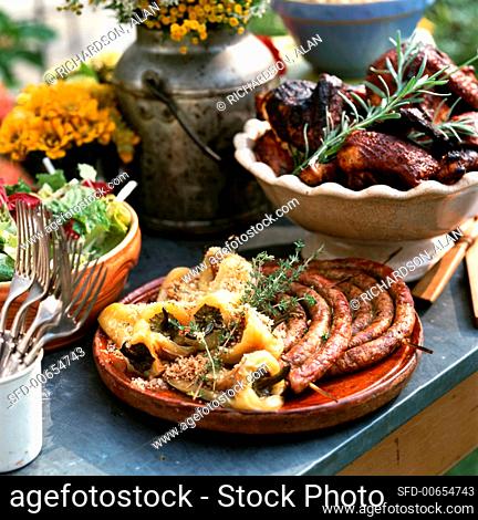 Platter with Grilled Sausage and Peppers with Thyme, Barbecued Chicken with Rosemary and Salad
