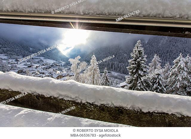 Bernina Express passes through the snowy woods around Filisur Canton of Grisons Switzerland Europe