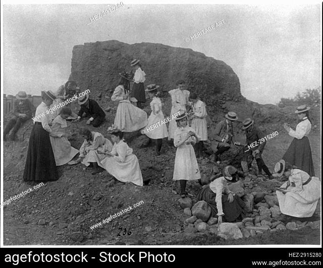 Washington, D.C. public schools field trip - 3rd Div. children examining rocks, (1899?). Creator: Frances Benjamin Johnston