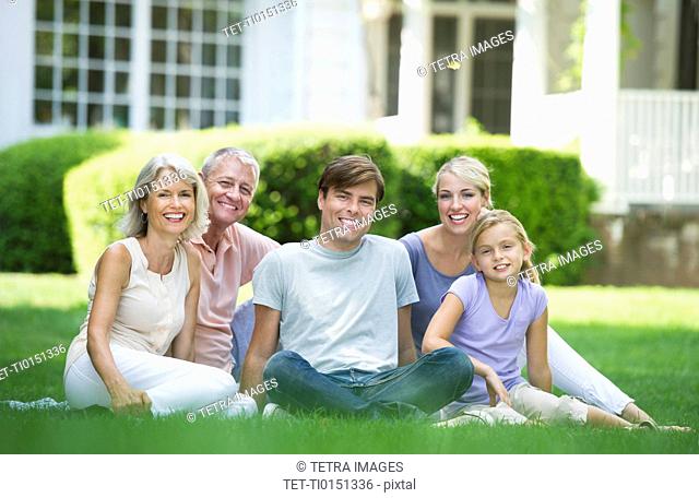 Portrait of girl 10-11 with parents and grandparents