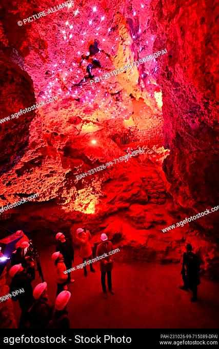 26 October 2023, Thuringia, Schweina: Visitors walk through the Altenstein Cave during the press tour before the reopening
