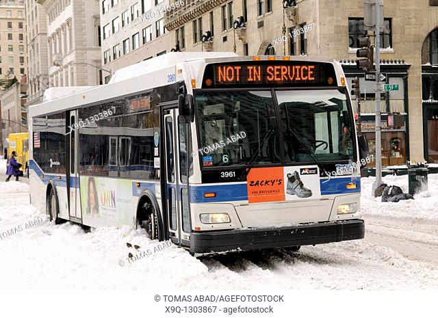 Snow Storm, December 26, 2010, New York City, 5th Avenue, 59th Street vicinity, Manhattan, MTA public bus, Bus sign reads 'Out of Service'