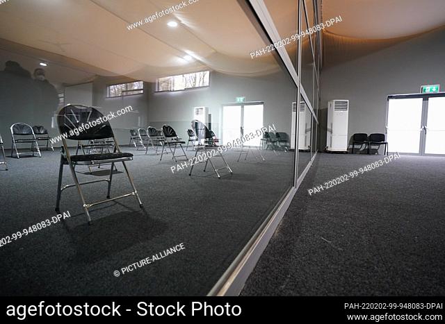 02 February 2022, Schleswig-Holstein, Kiel: Chairs stand in the auditorium, which is separated from the large hearing room of the Kiel Regional Court's branch...