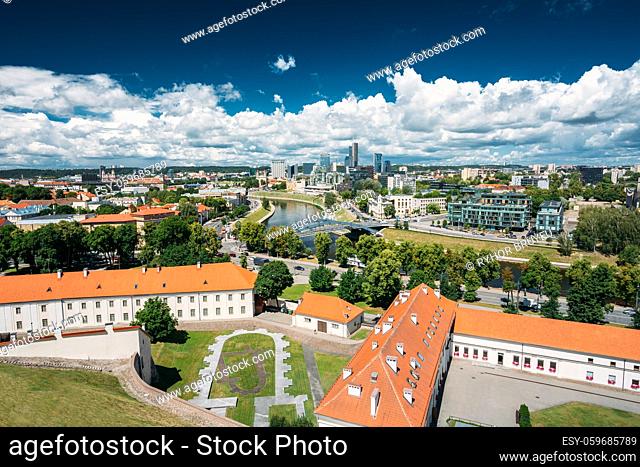 Vilnius, Lithuania. Modern City And Part Of Old Town Under Dramatic Sky In Summer Day. Behind New Arsenal At Northern Foot Of Castle Hill