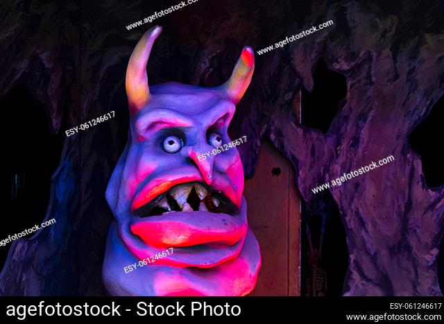 Vienna, Austria - August 16, 2019 : Devil monster in a ghost house at amusement park called Prater in Vienna, Austria