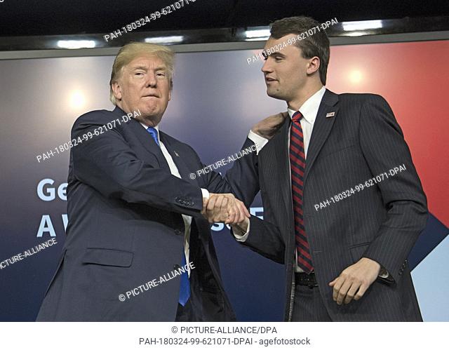 United States President Donald J. Trump, left, shakes hands with with Charlie Kirk, Founder and Executive Director of Turning Point USA, right