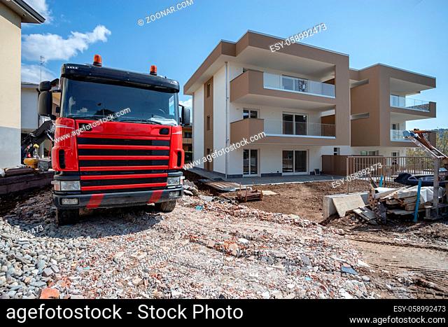 Truck on construction site. Trucking on construction concept. Tipper loaded with concrete bricks, building site. For construction theme illustrating