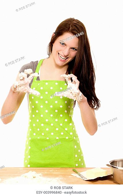woman forming claws with messy dough covered hands