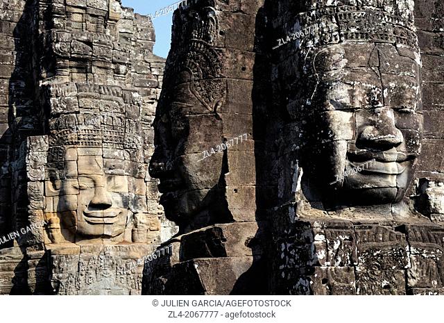 Enigmatic Lokesvara stone faces on the towers of the Bayon temple, Angkor Thom. Cambodia, Siem Reap, Angkor