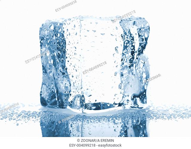 Single ice cube with water drops