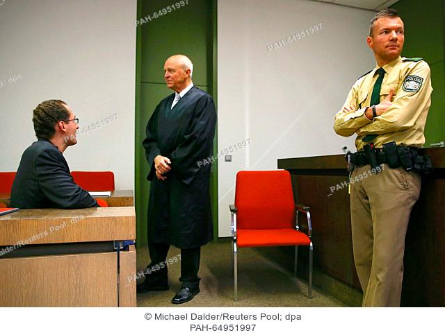 Defendant Markus R., a former employee of Germany's foreign intelligence agency (BND) talks to his lawyer Klaus Schroth (C) prior to his trial for espionage in...