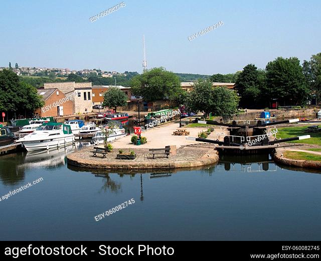 scenic view of brighouse basin with boats and moorings and the lock gates to the calder and hebble navigation canal in west yorkshire