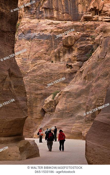 Jordan, Petra-Wadi Musa, Ancient Nabatean City of Petra, tourists walking through the Siq, NR