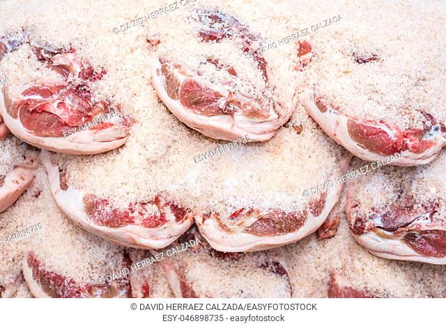 Salting process of iberian ham. Meat industry concept