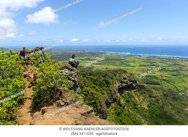 Hikers on the Sleeping Giant, also known as Nounou Mountain, a mountain ridge located west of the towns Wailua and Kapaa in the Nounou Forest Reserve on the...