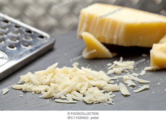 Grana Padano hard Italian cheese grated and whole