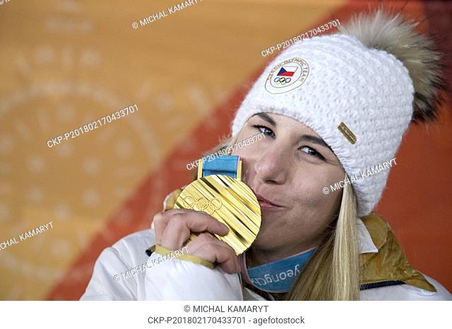 Czech alpine skier Ester Ledecka poses with her golden Olympic Medal which she won in Women's super-G Alpine skiing within the 2018 Winter Olympics in...