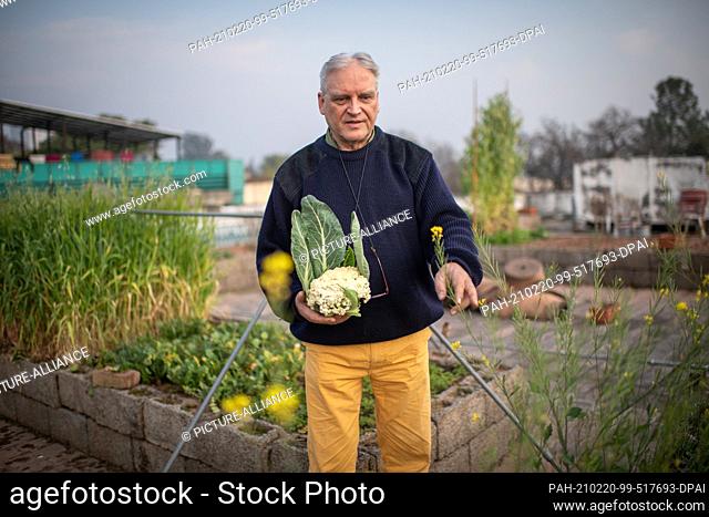 18 February 2021, Pakistan, Islamabad: Claus Euler, owner of ""Max und Moritz German Bakery"", stands on the roof terrace of his property in the Pakistani...