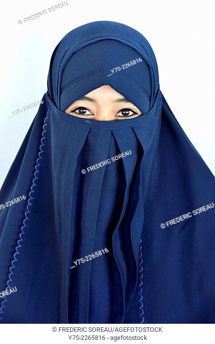 A young woman wearing a blue niqab in Sumbawa, Indonesia, South East Asia