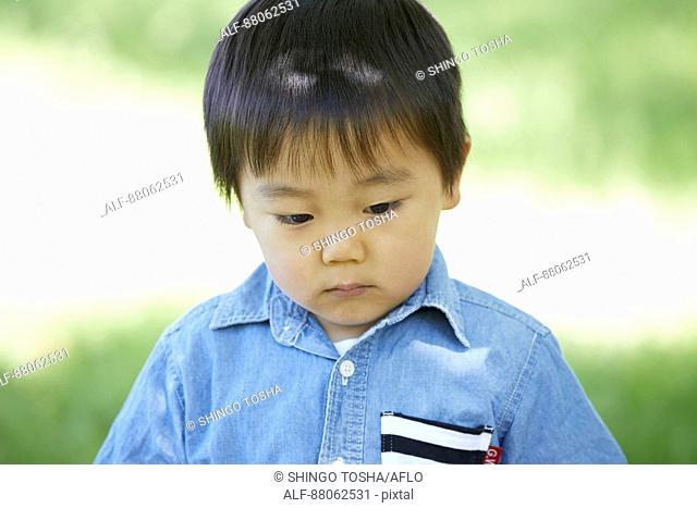 Japanese kid in a city park