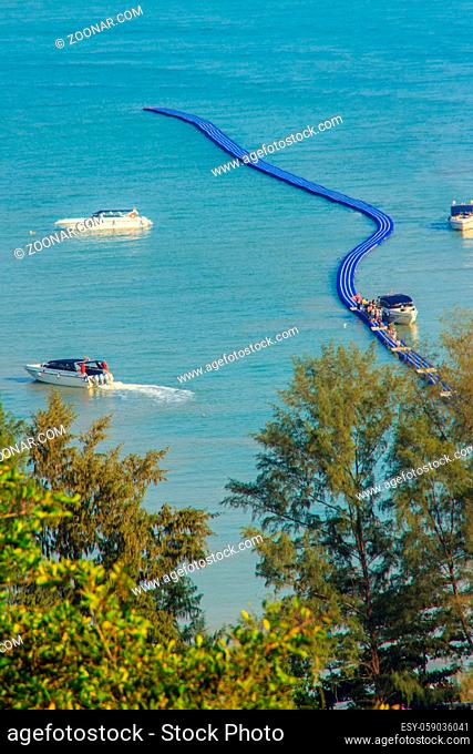Beautiful blue sea view and tourist water activities such as boat racing, yacht cruising and jet skiing on Koh Sire beach