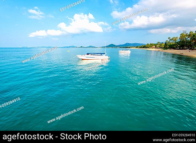 Beautiful natural landscape speed boats floating on the sea under the summer blue sky front of the Na Phralan beach in Ko Samui island is a famous attractions...