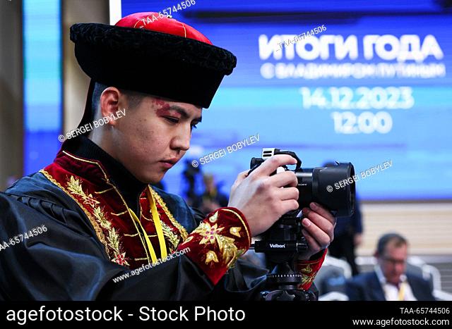 RUSSIA, MOSCOW - DECEMBER 14, 2023: A journalist in traditional costume is seen before the start of an annual national live televised question-and-answer...