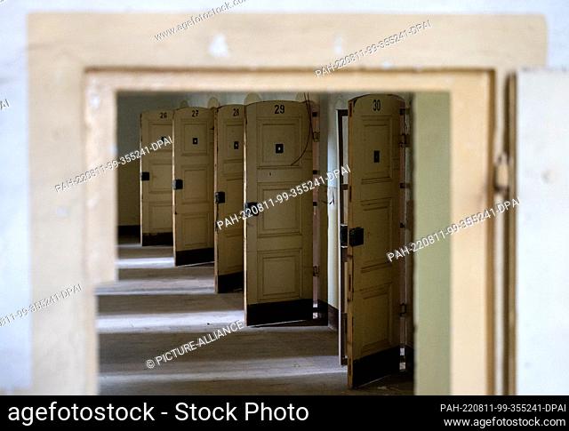 11 August 2022, Saxony, Stollberg: The doors in the cell wing of the former women's prison Schloss Hoheneck are open. Hoheneck was once the largest women's...