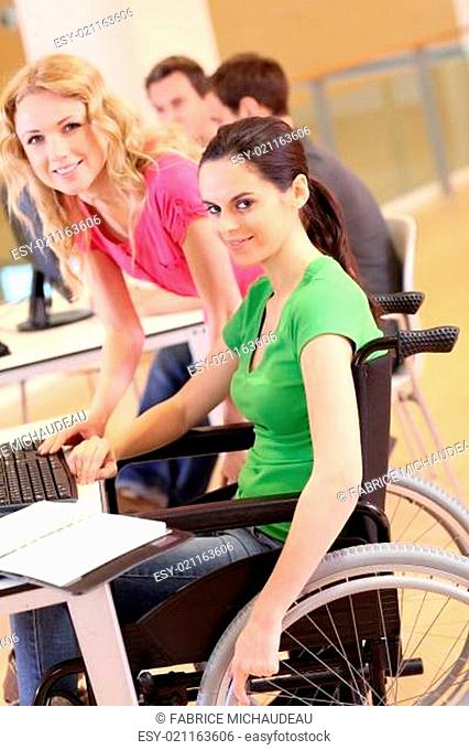 Handicapped person at work with electronic tablet
